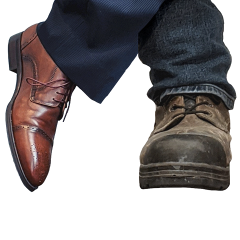 Call Todd Smith logo showing off his one workboot and one shoe while wearing both pants and jeans